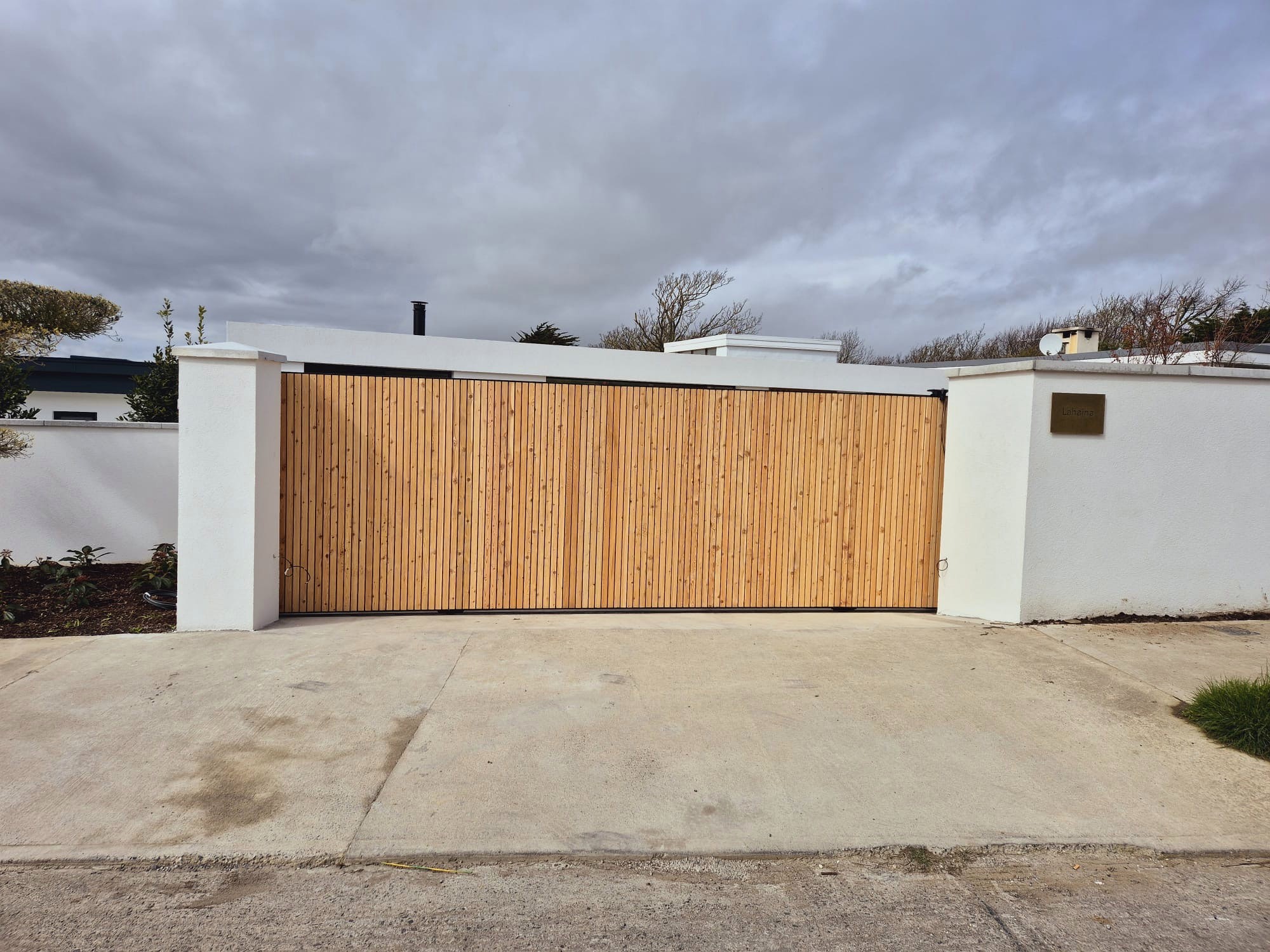 Cedar Clad Sliding Gate, steel fabrication project in Portmarnock, Co. Dublin by Churchtown Steel Engineering Dublin