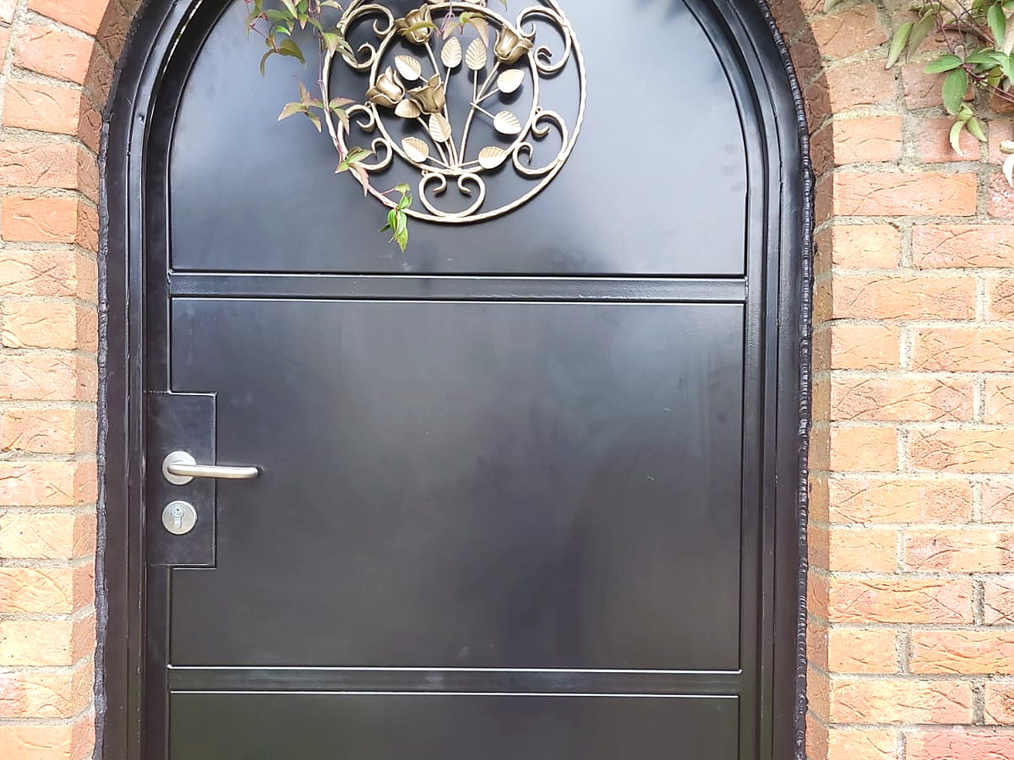 Arched Steel Gate with Brass Detail, steel fabrication project in Templeogue, Dublin 6W by Churchtown Steel Engineering Dublin