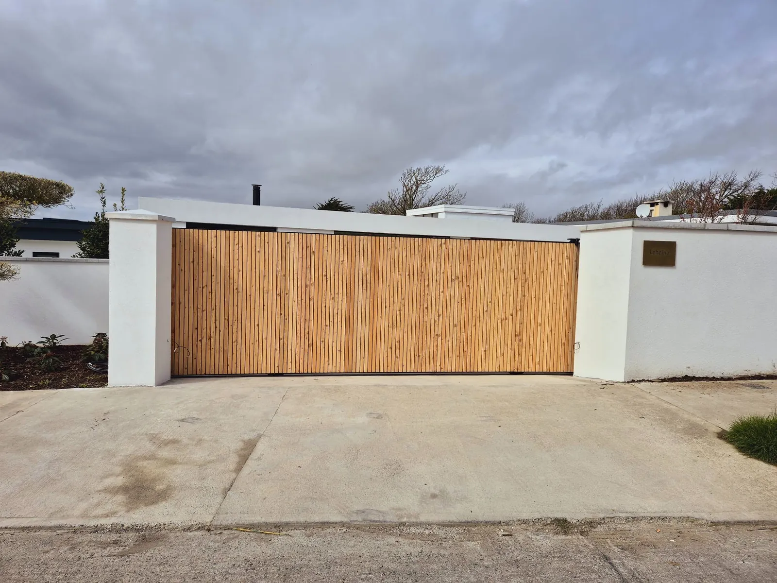 Cedar Clad Sliding Gate, steel fabrication project in Portmarnock, Co. Dublin by Churchtown Steel Engineering Dublin